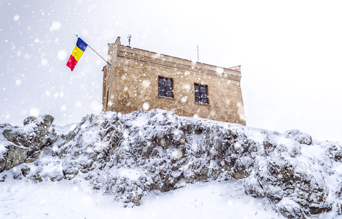 The Romanian flag hanging on the highest building in the citadel.