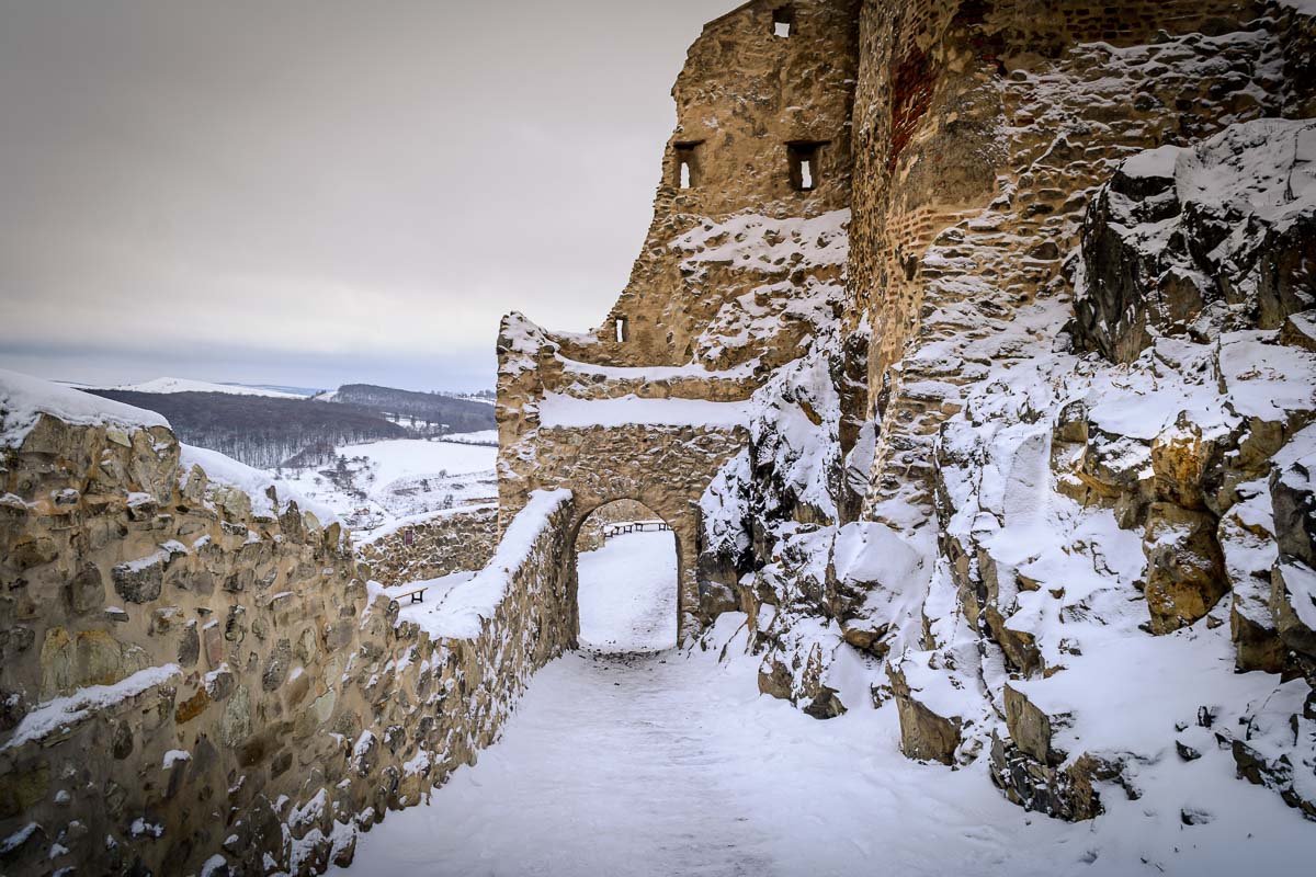 Path covered with snow within the ruins of the fortress.