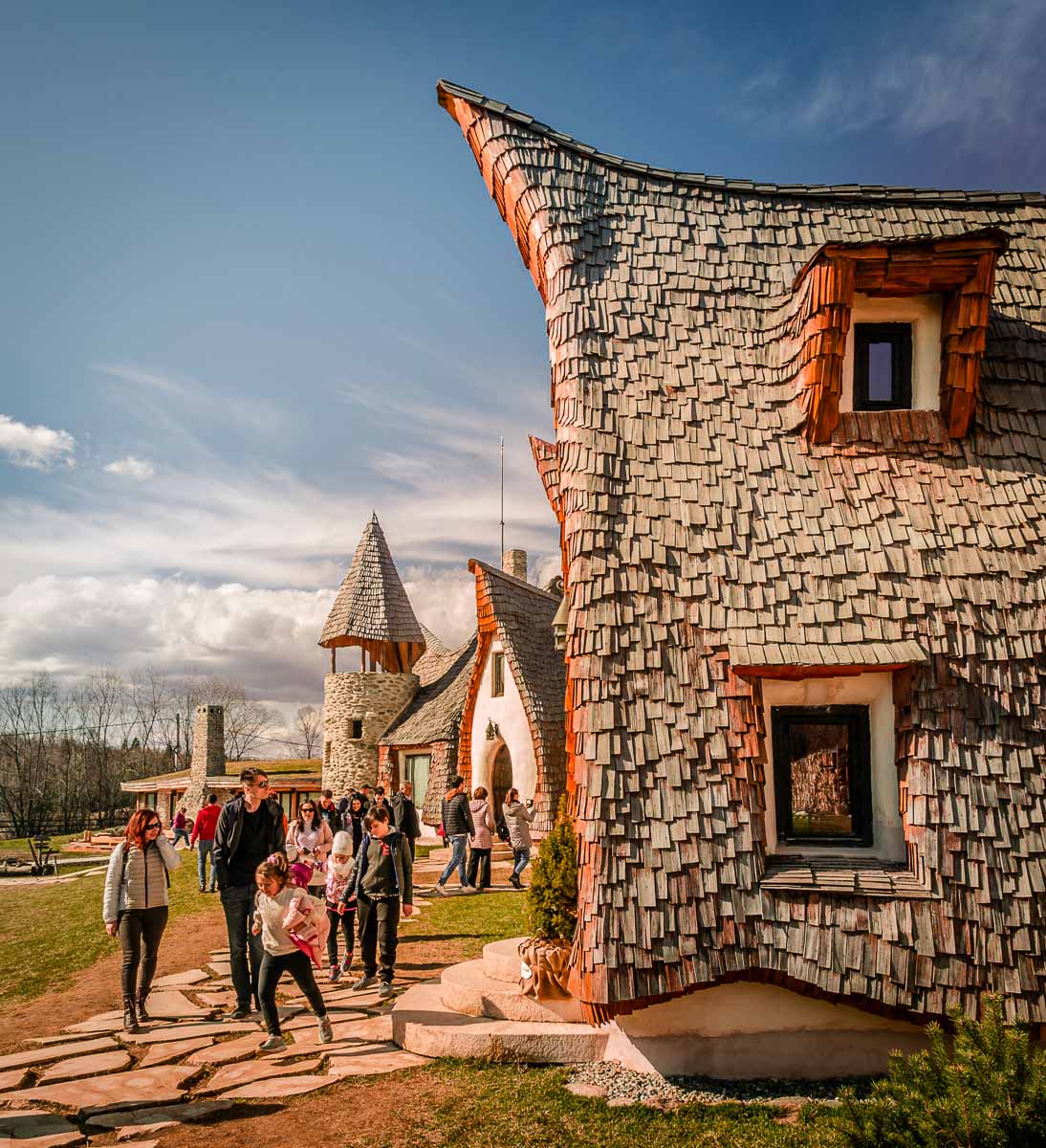 Tourists walking around near the Clay castle.