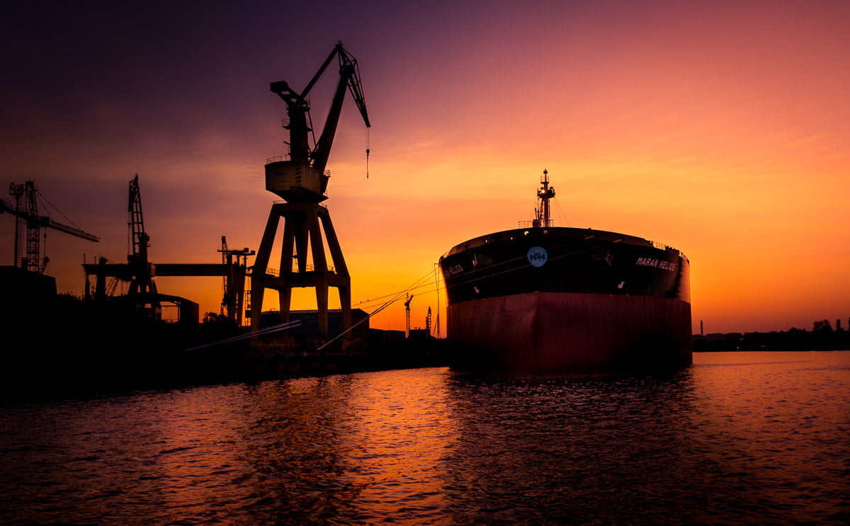 Large oil tanker docked in the shipyard.