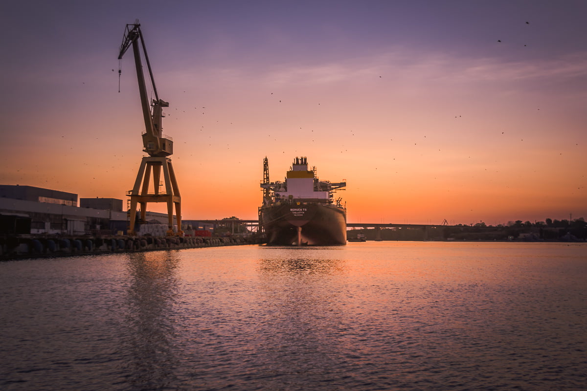 Another large ship docked in the shipyard.