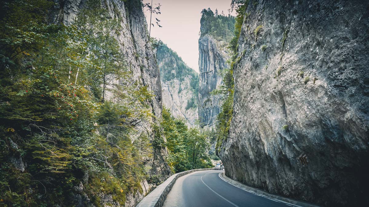 The national road between steep cliffs.