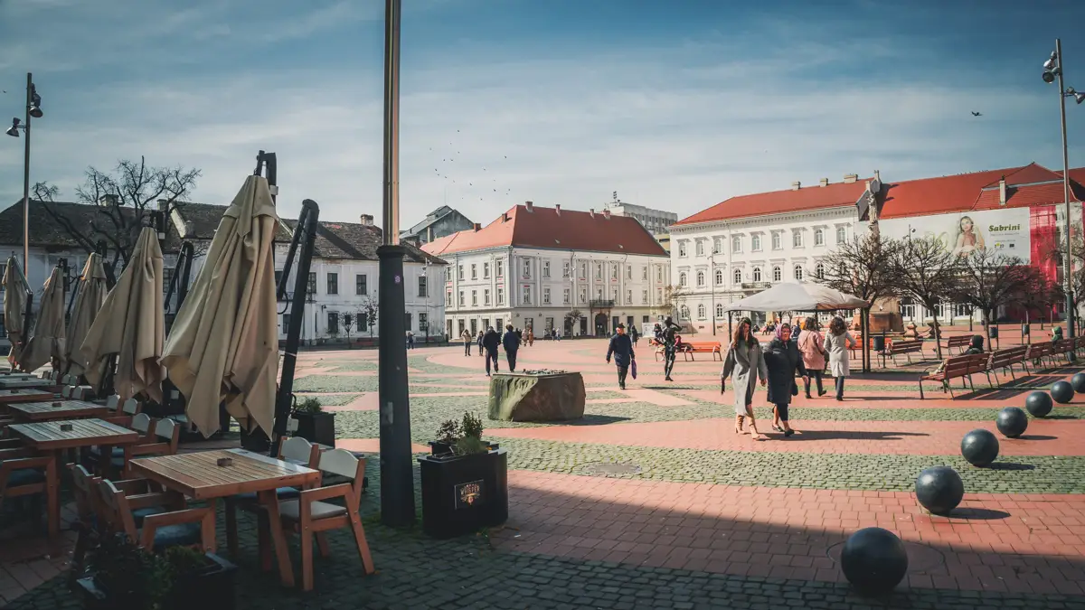 People walking in the Liberty Square on a beautiful sunny day.