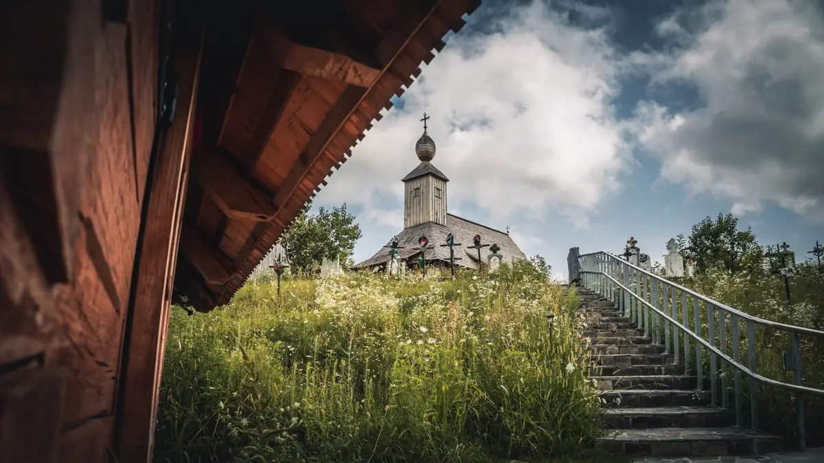 The cemetery and the wooden church in Romanesti.