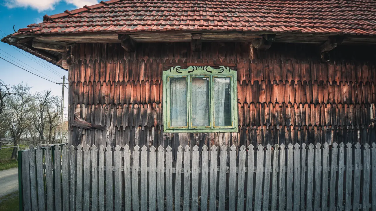 traditional house in Batrana with green window.