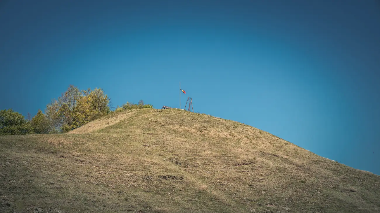A swing located on the top of the large hill overlooking the village.