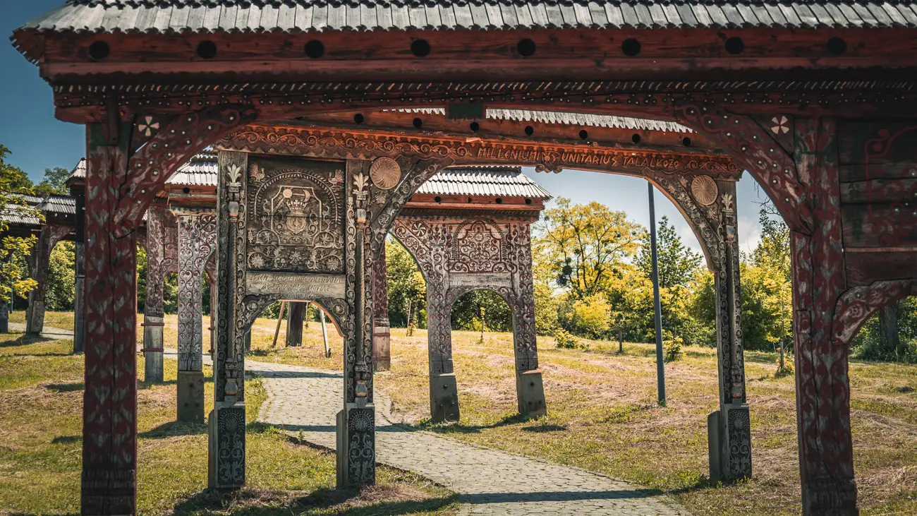 Traditional carvings etched into dark wood.